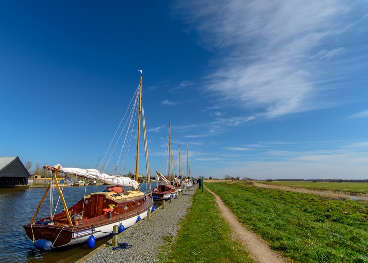 Eastwood Whelton yachts moored on the river bank in Norfolk